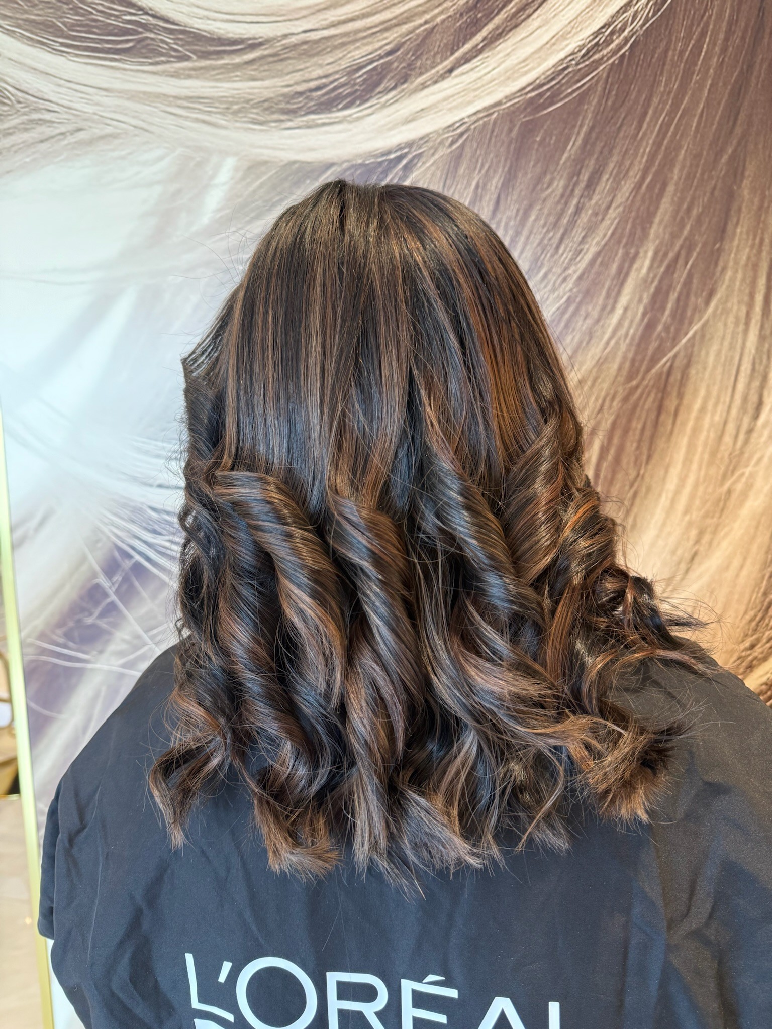 Silver-toned balayage colour result on layered hair at Lioréa Lounge