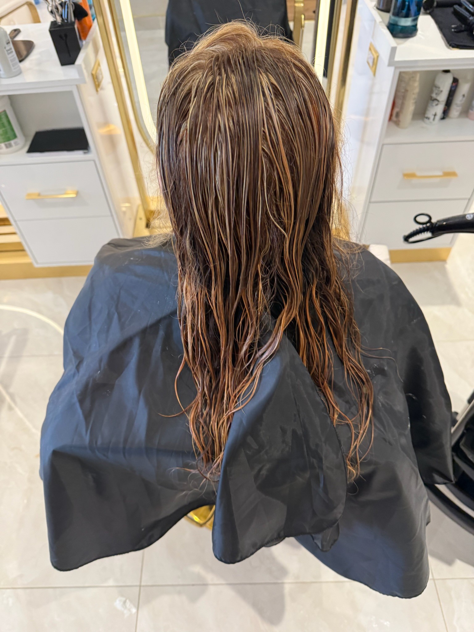 Rich brunette-to-caramel balayage colour result, back view, at Lioréa Lounge in Brampton