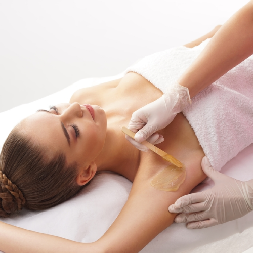 esthetician performing a gentle waxing treatment at Lioréa Lounge in Brampton